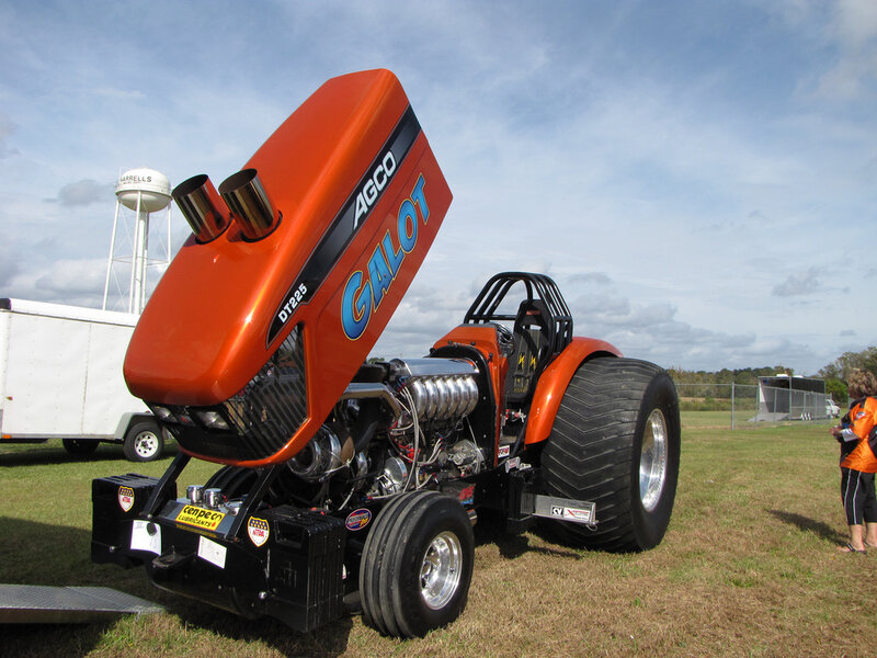 Orange racing tractor on display