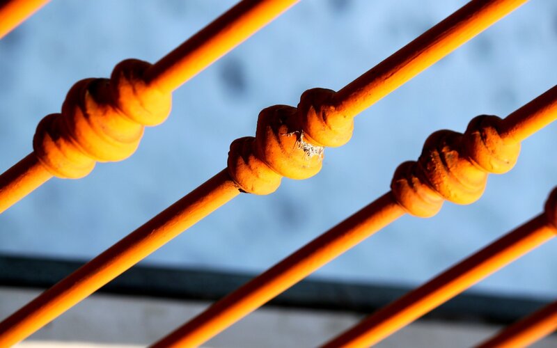 orange railings in sunlight