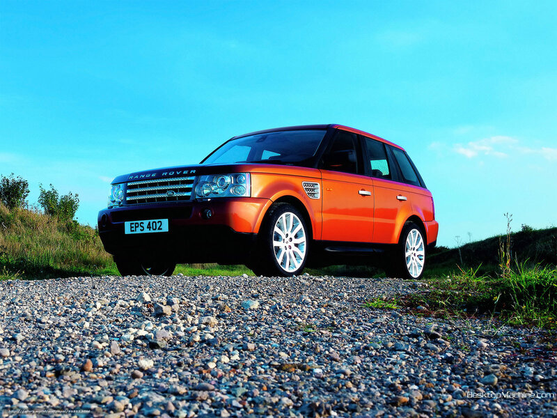Orange Range Rover on gravel