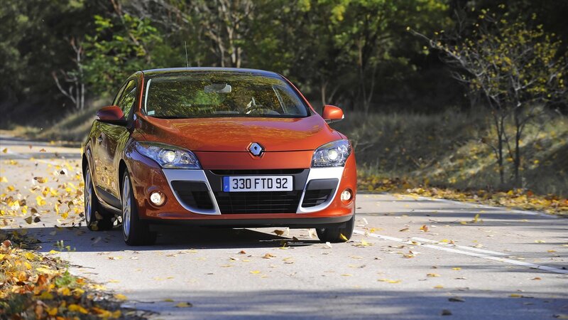Orange Renault on autumn road