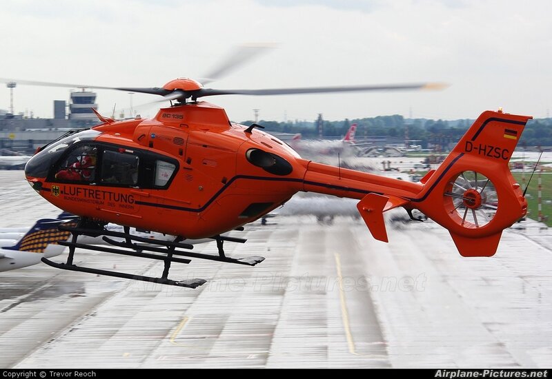 Orange rescue helicopter on tarmac