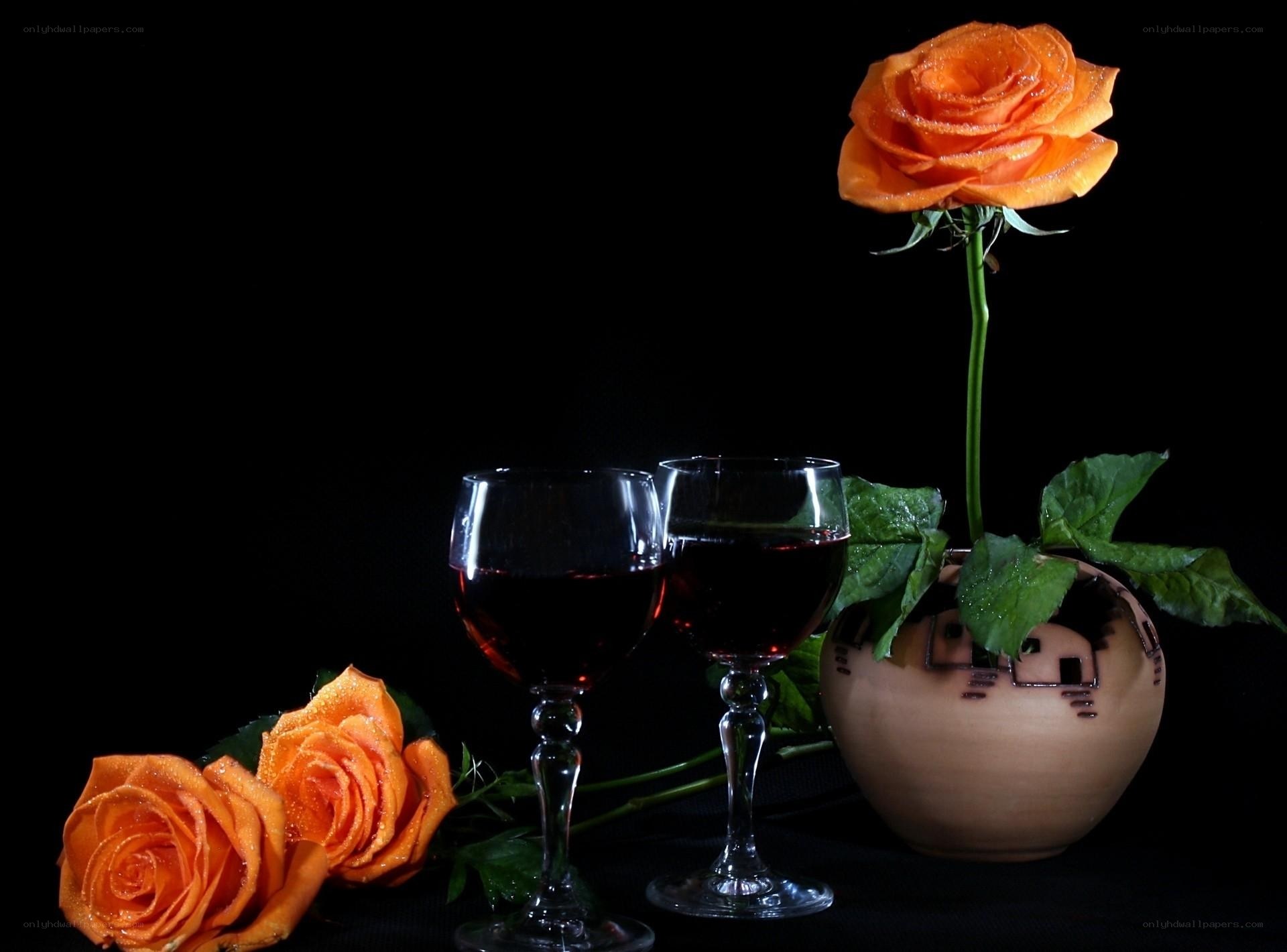 Orange roses and wine glasses