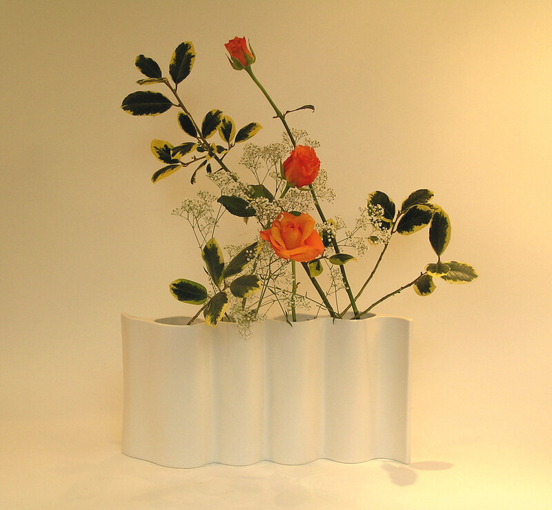Orange Roses in White Vase