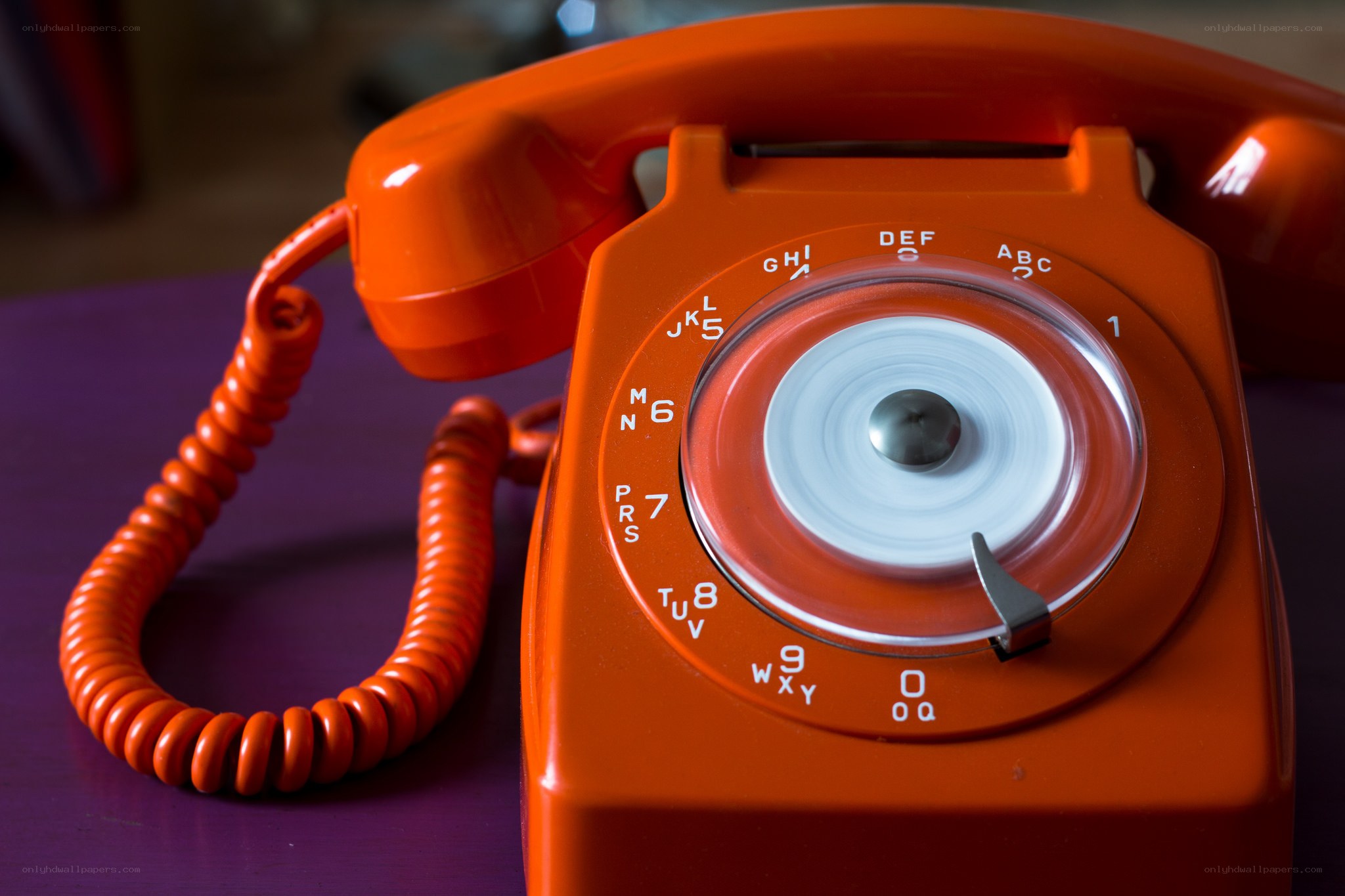 orange rotary telephone