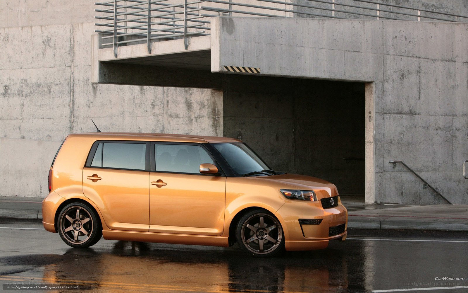 orange scion xB parked in garage