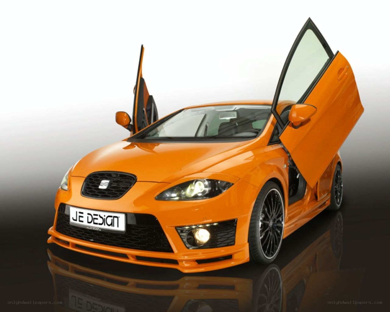 Orange SEAT car with open doors