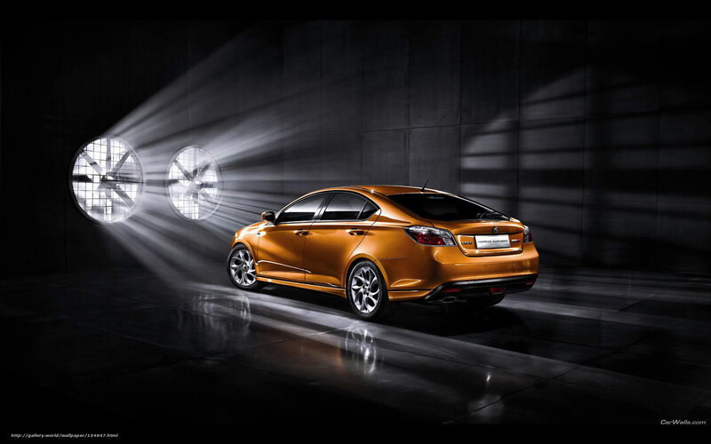 Orange sedan in dark garage