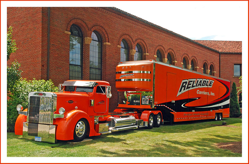 Orange Semi-truck — Calm, Afternoon, Photograph, Brick Building