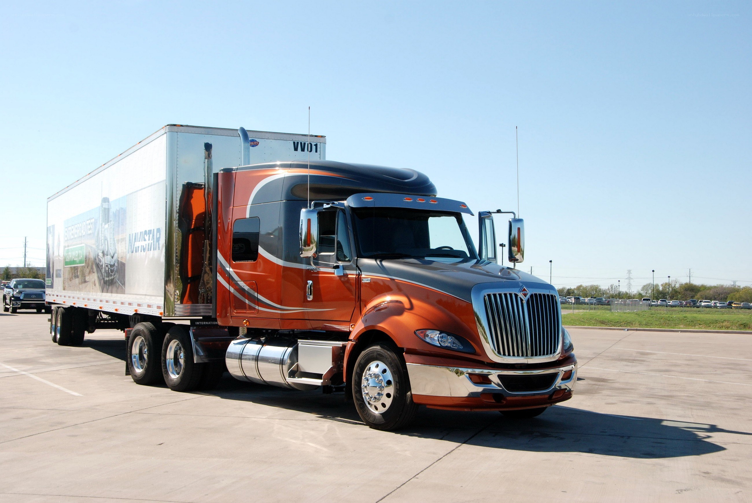 orange semi-truck with trailer