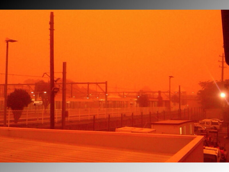 Orange sky at train station