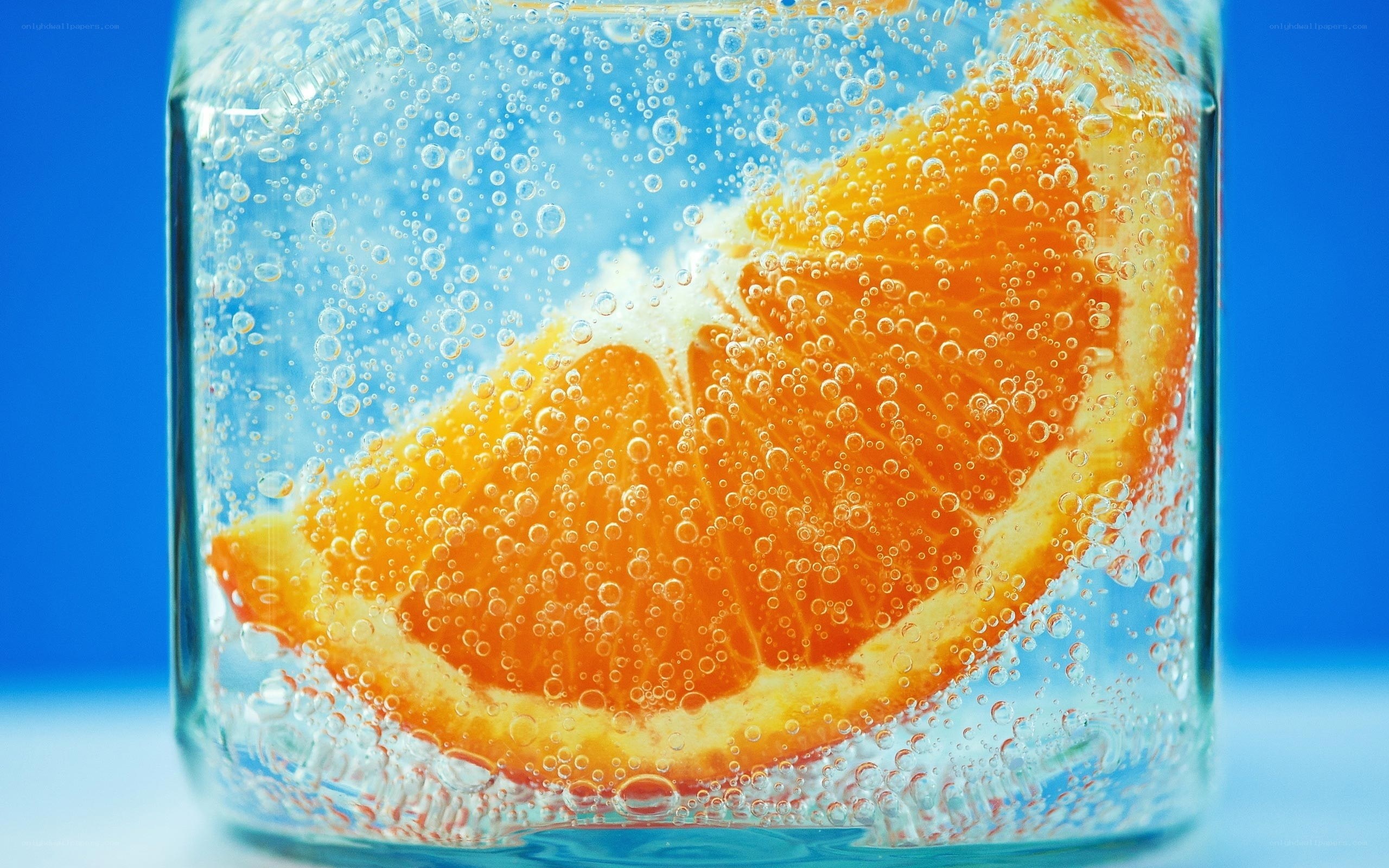 orange slice in sparkling water