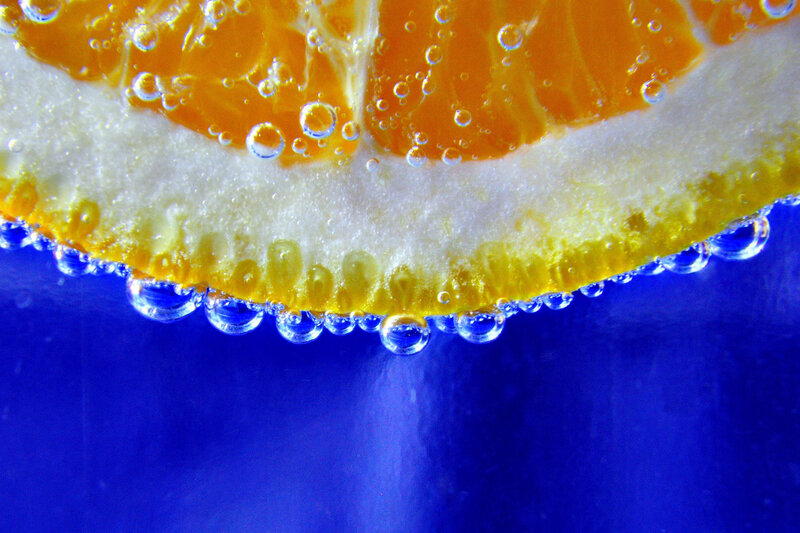 Orange Slice in Water — Blue, Refreshing, Photograph, Bubbles