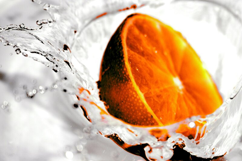 Orange Slice in Water — Dynamic, Photograph, Splashes, Fruit