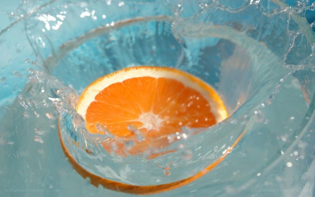 Orange slice in water splash