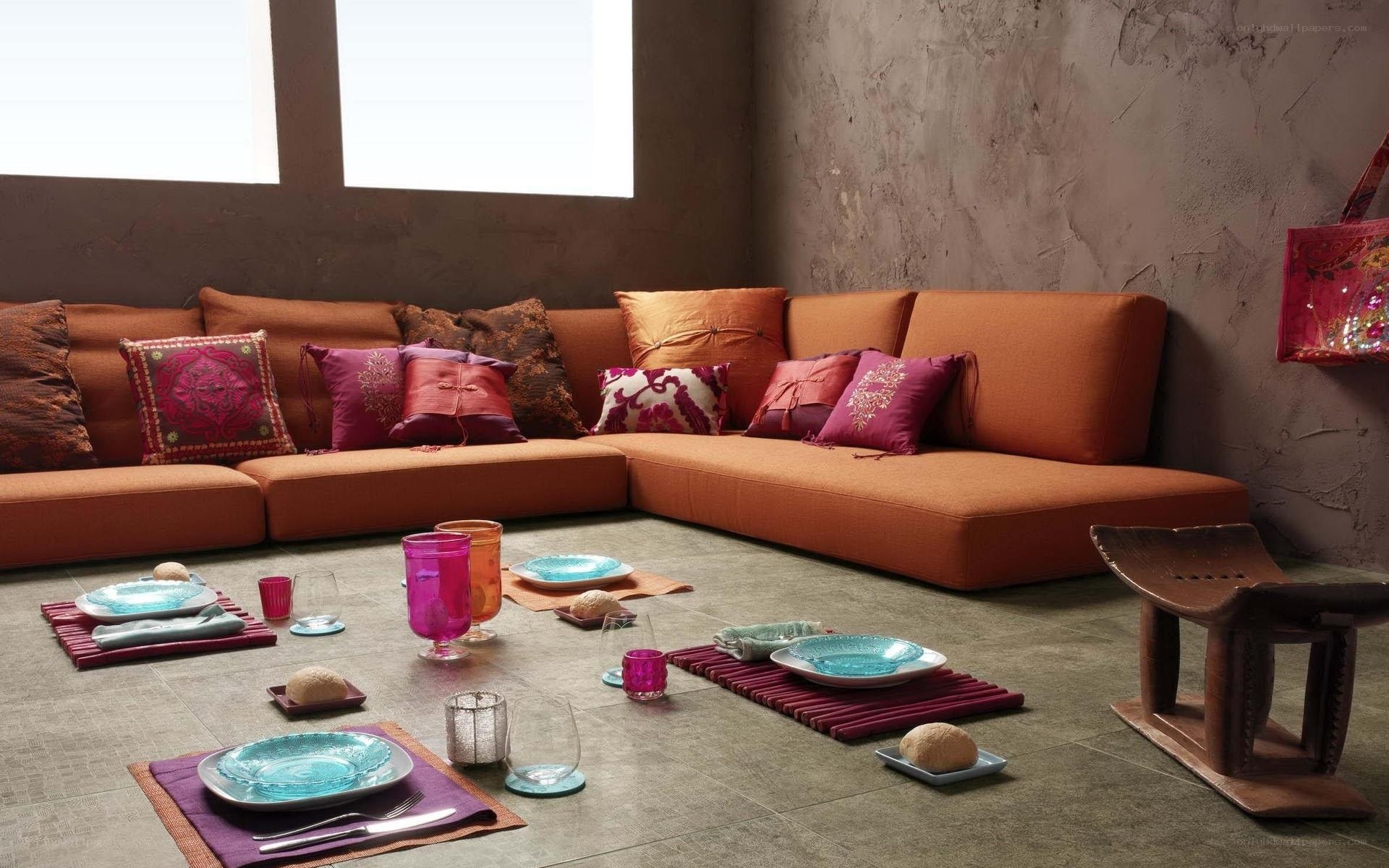 Orange sofa with colorful cushions