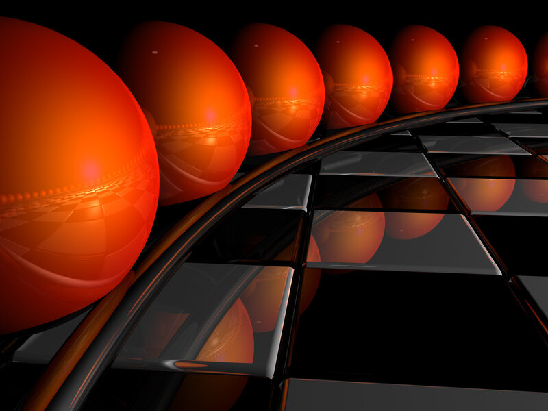 Orange spheres on reflective surface