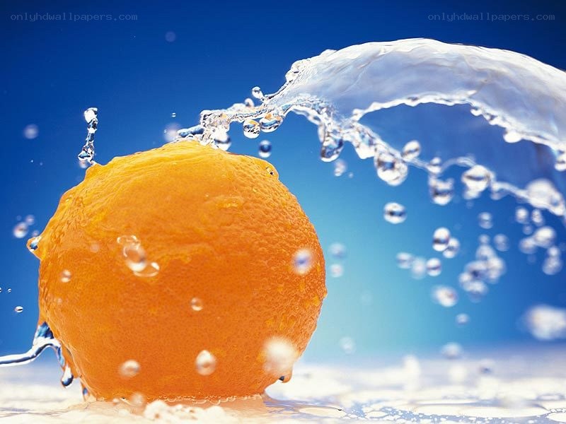 orange splashing in water