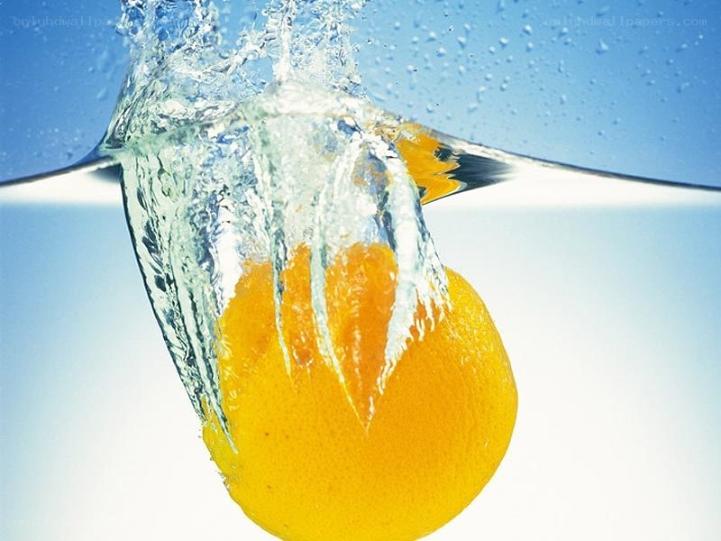 orange splashing in water