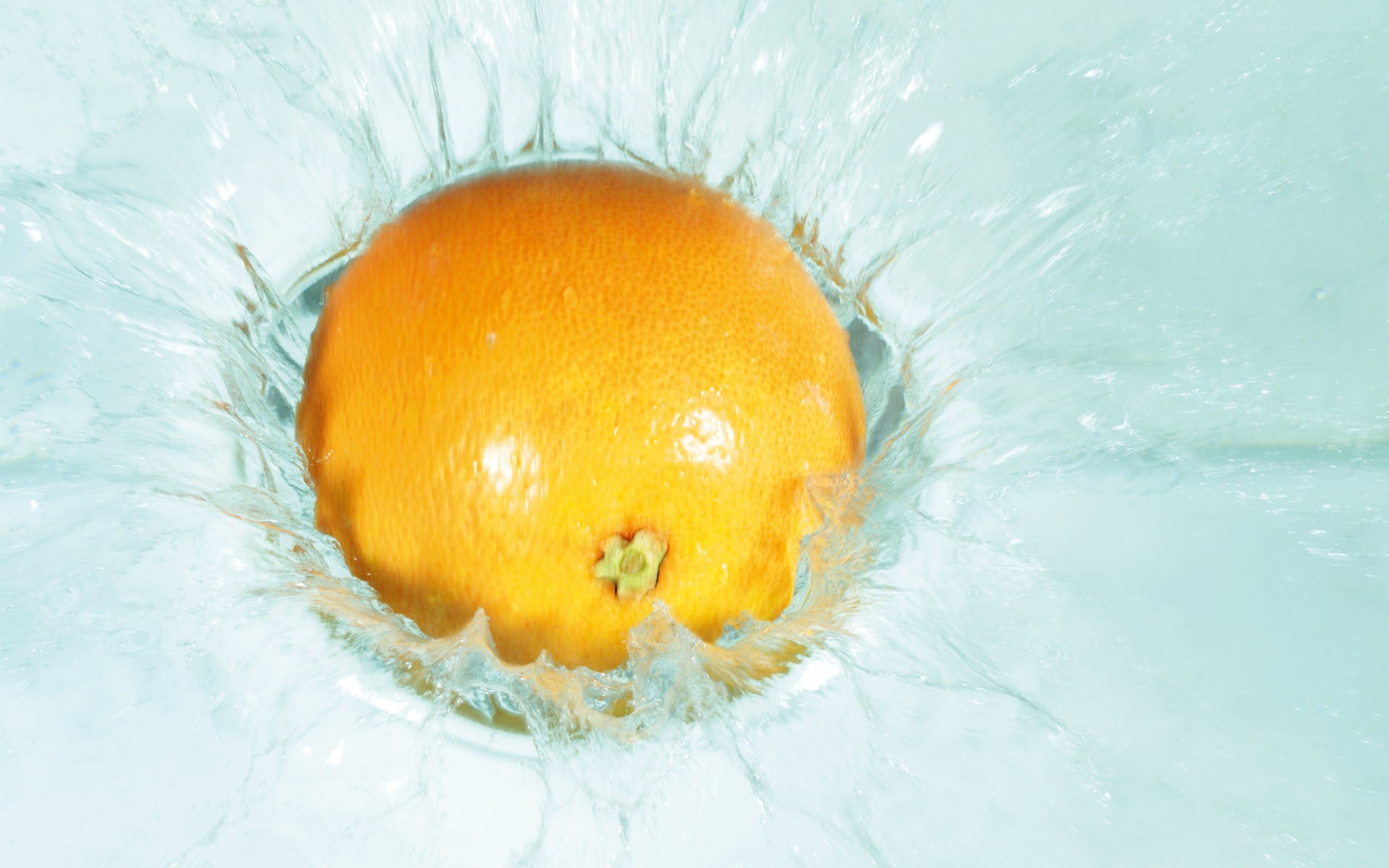 orange splashing in water