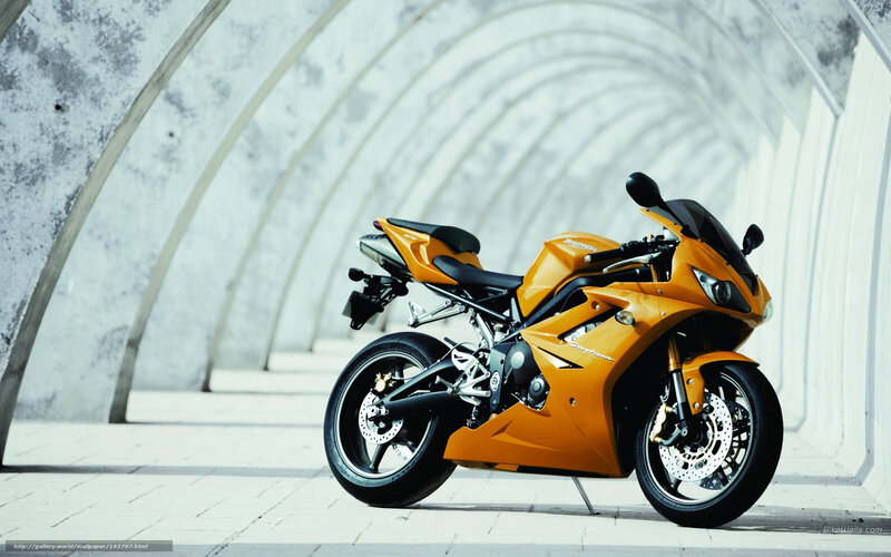 orange sport motorcycle in tunnel