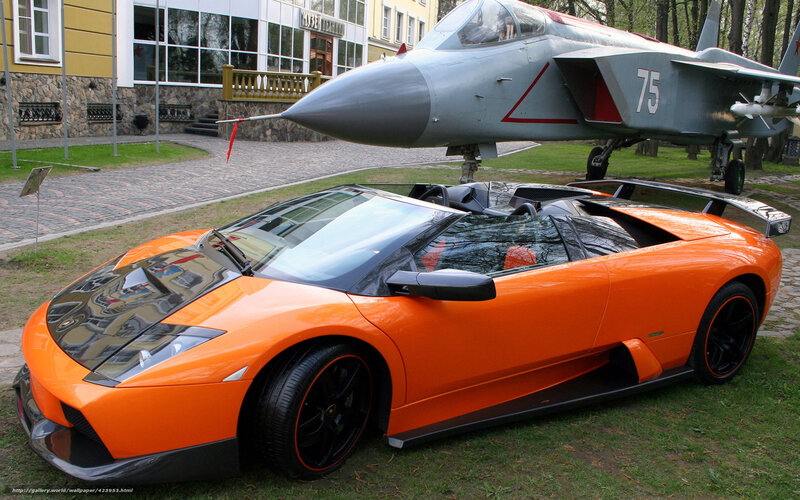 Orange sports car and jet display