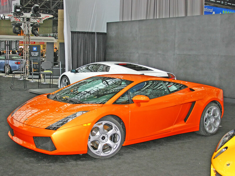 Orange sports car at auto show