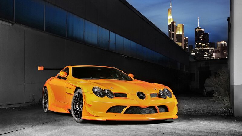 orange sports car at night