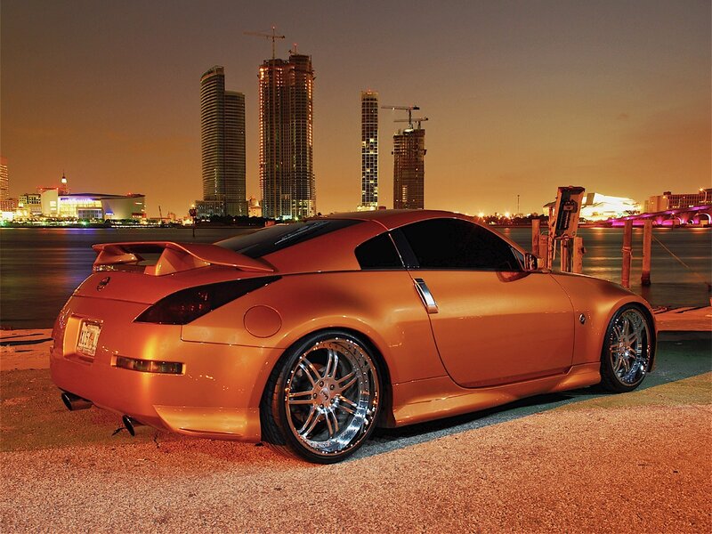 Orange sports car at night
