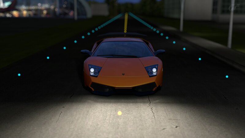 Orange sports car at night