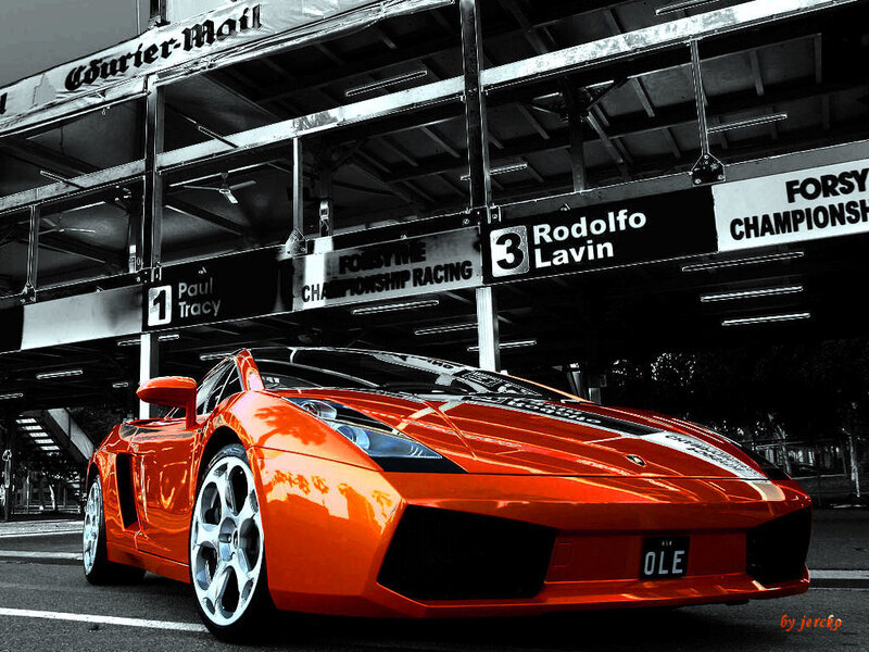Orange sports car at racetrack