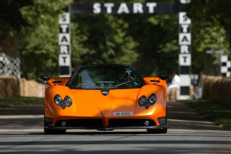 Orange sports car at start line