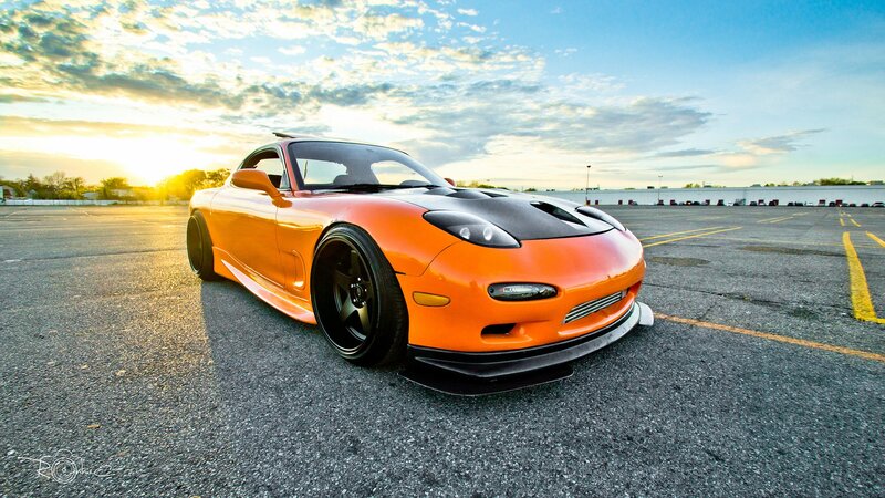 orange sports car at sunset