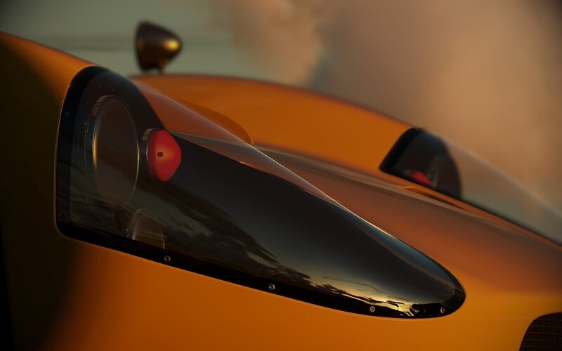 orange sports car at sunset