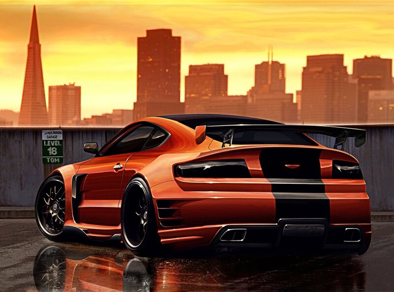 Orange sports car at sunset