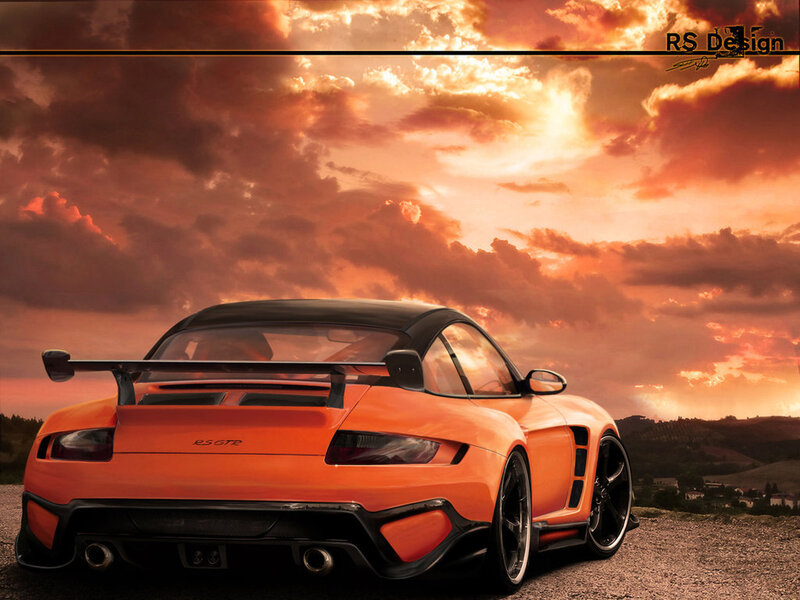 Orange sports car at sunset