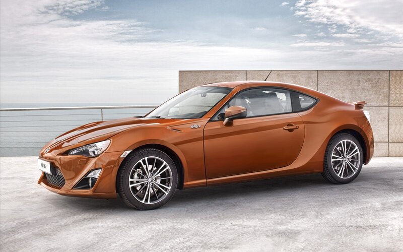 Orange Sports Car — Brown, Serene, Afternoon, Photograph