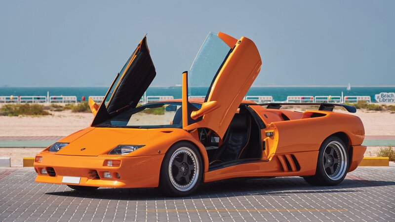 Orange Sports Car — Calm, Afternoon, Photograph, Beach