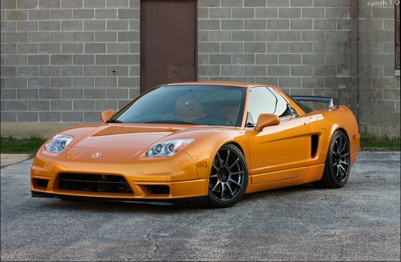 Orange Sports Car — Calm, Afternoon, Photograph, Brick Wall