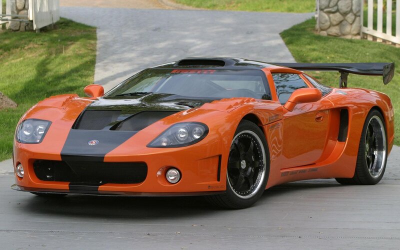 Orange Sports Car — Calm, Afternoon, Photograph, Grass
