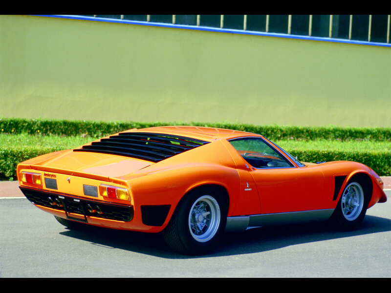 Orange Sports Car — Calm, Afternoon, Photograph, Hedge