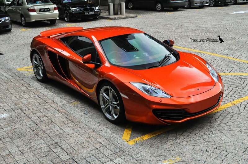 Orange Sports Car — Calm, Afternoon, Photograph, Parking Lot, Cars