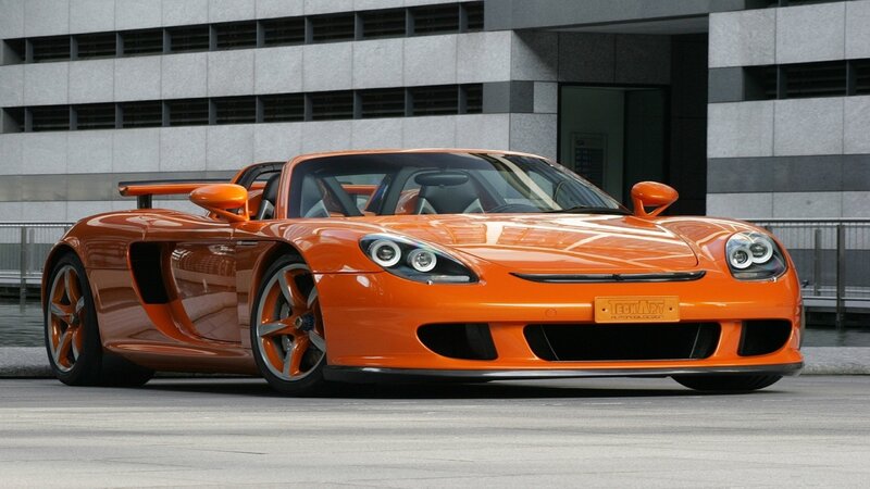 Orange Sports Car — Dramatic, Afternoon, Photograph, Building, Tire