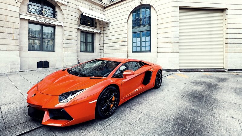 Orange Sports Car — Dramatic, Afternoon, Photograph, Building, Windows, Pavement