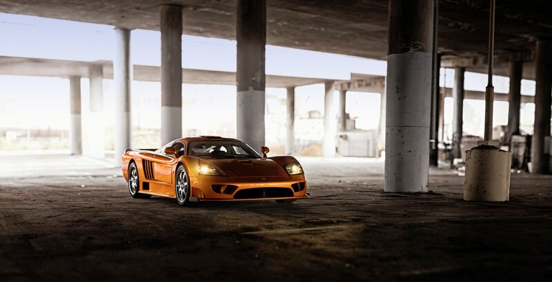 Orange Sports Car — Dramatic, Afternoon, Photograph, Concrete Pillars