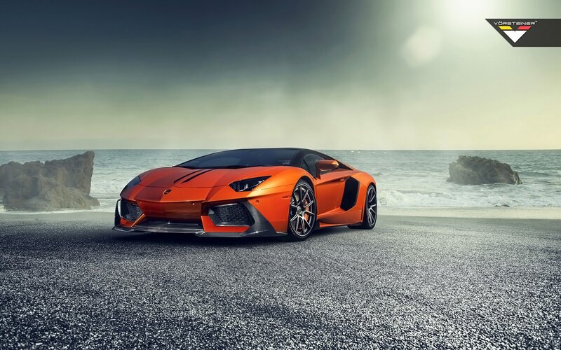 Orange Sports Car — Dramatic, Afternoon, Photograph, Ocean, Rocks