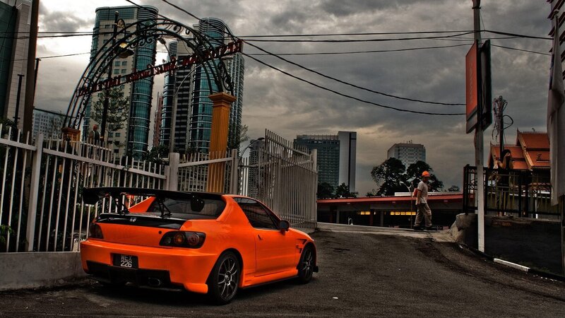 Orange Sports Car — Dramatic, Afternoon, Photograph, Skyscrapers