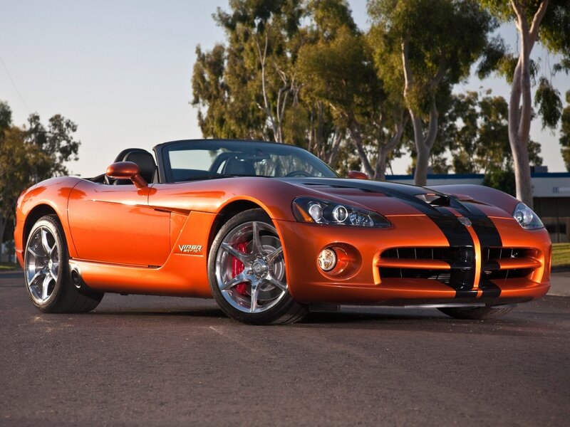Orange Sports Car — Dramatic, Afternoon, Photograph, Trees, Road, Building