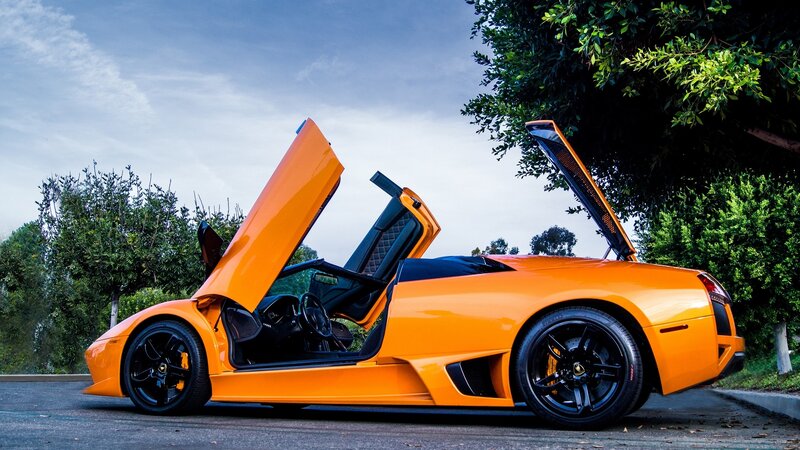 Orange Sports Car — Dramatic, Afternoon, Photograph, Trees, Sky, Road