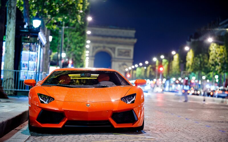 Orange Sports Car — Dramatic, Night, Photograph, Arc De Triomphe, Streetlights, Trees