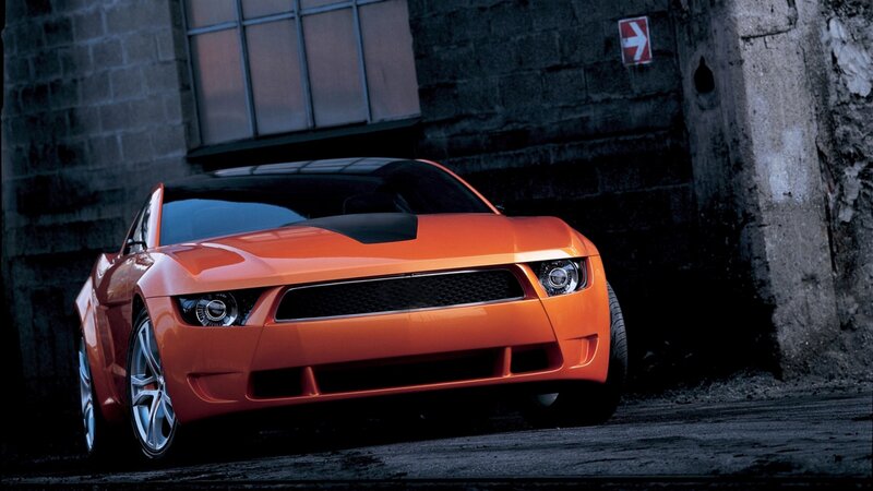 Orange Sports Car — Dramatic, Night, Photograph, Brick Wall